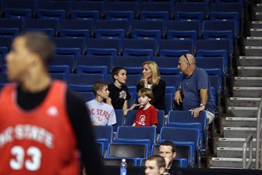 Kay Barefoot sits her husband, Philip Whitfield, and three sons, Hunter, Noah and Elijah, as the family watches N.C. State practice at the St. Pete Times Forum on Wednesday afternoon.