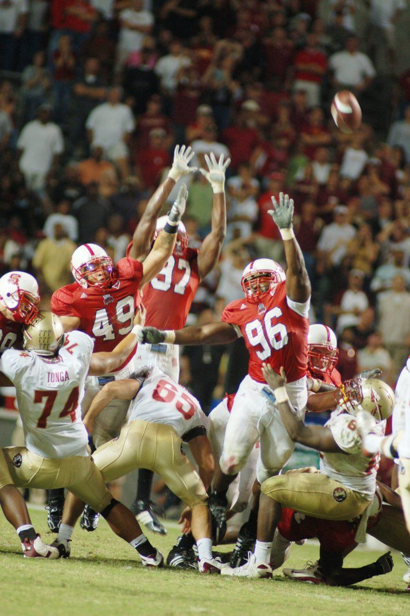 N.C. State's defensive line tries to block a field goal against Florida State.