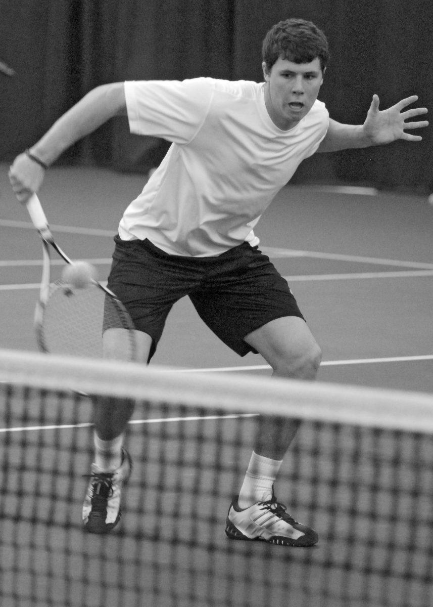 Senior Jay Weinacker volleys a shot during a spring practice.