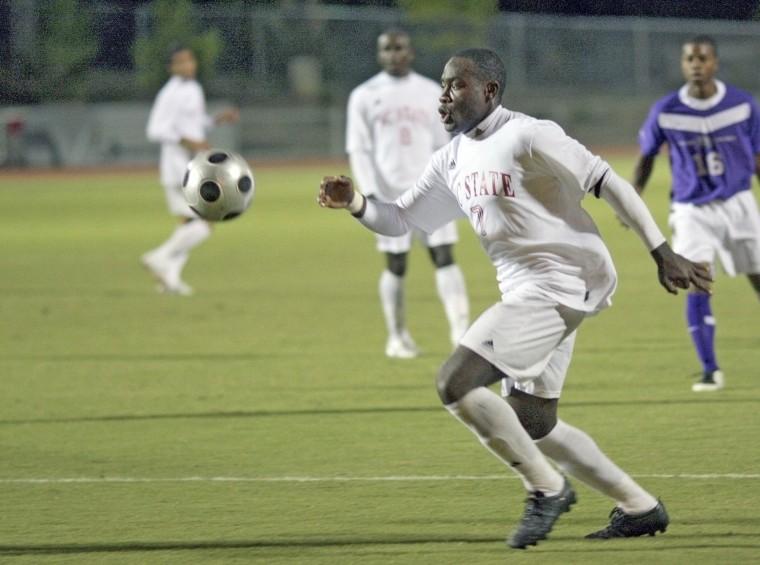 Redshirt junior forward Ronnie Bouemboue dribbles up the field during a game against High Point on Sept 24