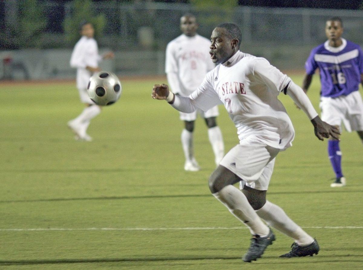 Redshirt junior forward Ronnie Bouemboue dribbles up the field during a game against High Point on Sept 24