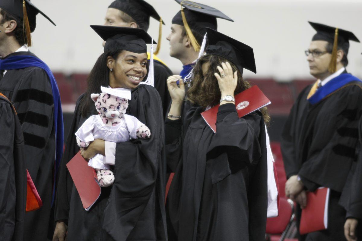 Damita Chambers, a senior in public administration walks in to graduation Dec. 17 at the RBC Center. NCSU conferred 2,917 degrees Wednesday. Photo by Tim O'Brien.