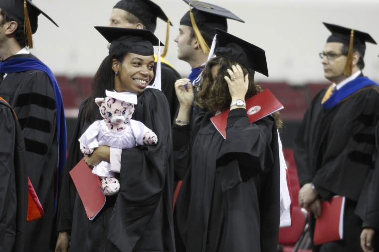 Damita Chambers, a senior in public administration walks in to graduation Dec. 17 at the RBC Center. NCSU conferred 2,917 degrees Wednesday. Photo by Tim O'Brien.