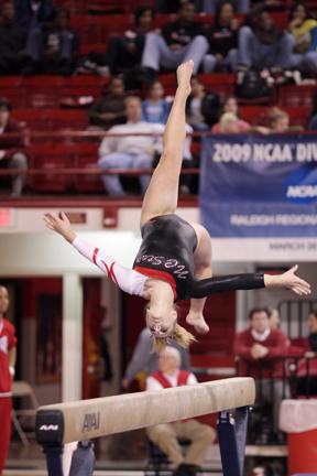 Freshman Jess Panza flips down the beam during Friday's gymnastics meet against the Univerisy of Illinois at Chicago. The Pack defeated the Flames 193.375 to 187.975.