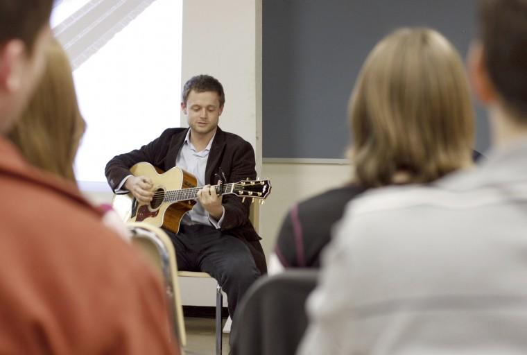 Brooks Wood, a 2006 alumnus, sings and plays guitar at the Hillsborough Street Renaissance community meeting on Monday at the Pullen Arts Center. The purpose of the meeting was to help plan and promote the March 14 event that aims to revitalize the Hillsborough Street area. The event will feature live music, including Wood's band the Brook Woods Band and a hip-hop band called Inflowential. Both groups played a demo at the meeting. "Everybody in the band graduated from NC State," Wood said. "Ther
