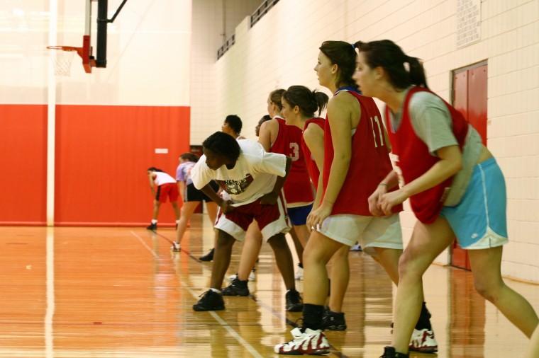 The women's club basketball team lines up for a drill last season.