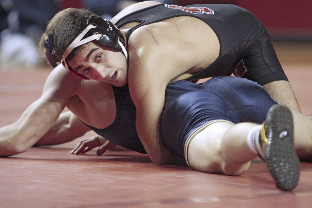 Caramanica grapples with a Navy foe.