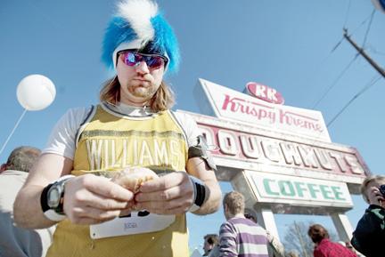 Williams High School teacher Brian "Shaggy" Smith eats his doughnuts while competing in the Krispy Kreme Challenge Saturday morning. Photo by Matt Moore