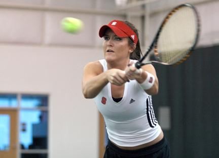 Sophomore Berkeley Brock returns a volley during her doubles match against Davidson at J.W. Isenhour Tennis Complex Friday Jan. 27, 2008. Brock won her doubles match with partner Daria Petrovic and the clinching point for the Wolfpack victory in straight sets.