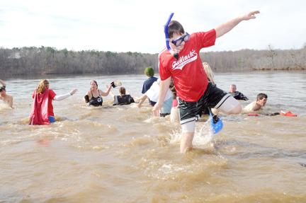 Tim Scranton, then a sophomore in middle school math education, makes his way out of the 39 degree water of Lake Raleigh for last year's Polar Plunge. Scranton plunged as a part of the Sadlack's Heroes team who raised an estimated $500 for the event. Scranton has volunteered for the Special Olympics off and on for the past 10 years and helped out at the Summer World Games when they were held in Raleigh. "We just thought it was a great cause. Special Olympics is a worthy cause and always needing