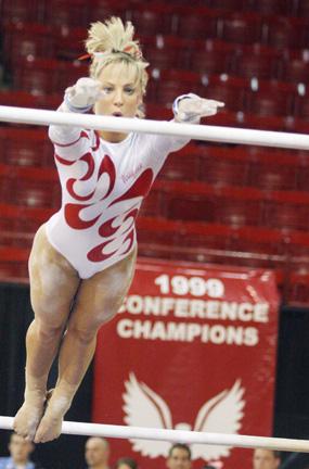 Junior Taylor Seaman leaps onto the high bar during the uneven bars competition in the meet against George Washington Mar. 13. The gymnastics team is hosting the EAGL Championships this Saturday at 3 p.m. in Reynolds Coliseum.