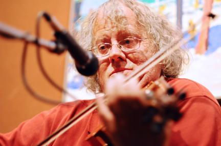 David McKnight, also known as the Hillsborough Fiddler, plays the violin at the Irregardless Cafe on Morgan Street. McKnight plays in the cafe with his friends and alumnus, Bruce Emery, when he is not playing with different bands in the Triangle area or outside Global Village. "What I enjoy is taking all the fundamentals and practice and to share the music at a sit-down setting or like at Global village with people getting coffe," McKnight said. Photo by Luis Zapata