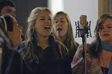 Julie Steinberg, sophomore in food science, Janine Largen, senior in business, Addie Thornton, a sophomore in natural resources, and Megan Sadler, a sophomore in zoology, sing with A Cappology outside Sullivan Hall Thursday night. Largen has been a member of the a capella group since her freshman year. "It has kept music in my life all throughout college, which wouldn't have happened if I wasn't in the group," Largen said. Photo by Dreier Carr.Photo by Dreier Carr