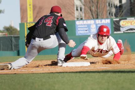 Freshman Cameron Conner slides safely back into first after getting caught trying to steal second base in the game against Santa Clara Feb. 22. The Pack will face Virginia Tech this weekend in its fourth ACC series of the year. The Pack is 3-6 in the ACC while V.T. has a 2-6 conference record.