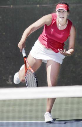 Berkeley Brock, a junior in communication, serves to Florida State's Noemi Scharle at the Cary Tennis Complex in the ACC Women's Tennis Tournament Thursday. The women's tennis team did not advance to the next round in the tournament.