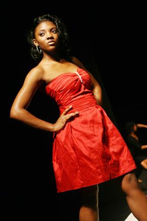 Erika Reid, a senior in psychology, models a dress made by Jessica Fulks, a senior in textiles and apparel management, from her clothing line called "Lache" at the African American Textiles Society Fashion Show, held on April 2 in Steward Theatre. "Urban culture can be exciting adn bold but yet class. The line will show the best of both worlds