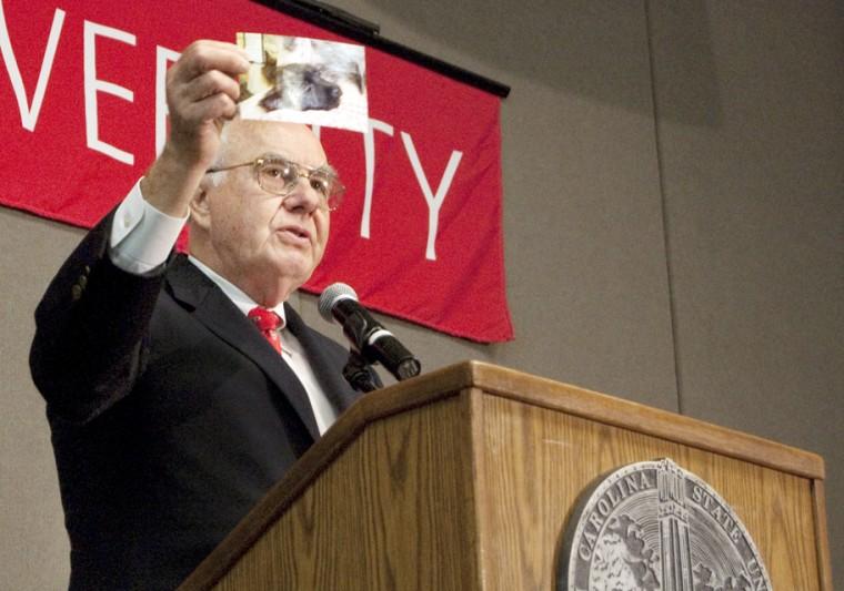 Chancellor Jim Woodward holds up a picture of Mattie Pearl Woodward, his cairn terrier puppy. Woodward said the University should adopt his pup as an unofficial mascot since she resembles a young wolf.