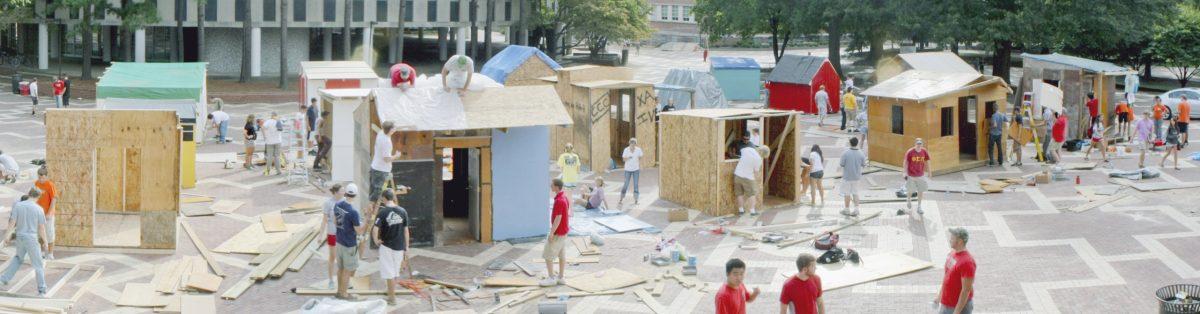 Organizers construct shacks on the Brickyard Sunday in preparation for Habitat for Humaniy&#8217;s Shack-a-thon. Organizations compete to raise money for building homes for the needy. Photo by Kevin Cook