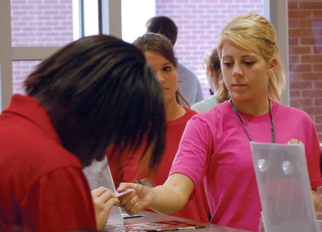 Ashley Nichols, a freshman in chemistry, uses her student ID card to enter the Carmichael Recreation Center Monday.&#8220;I think you should have to present it. Anyone can make up a number,&#8221; Nichols said. Photo by Jeffrey Fowler