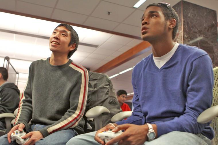 Ken Kimber, graduate student in public administration, and Eugene Yap, junior in chemistry, play Halo 3 ODST in the D.H. Hill Library. &#8220;I prefer to play in the library because of the huge screen and the people here,&#8221; Kimber said. &#8220;I come here to study but always bring my ODST for playing after.&#8221;