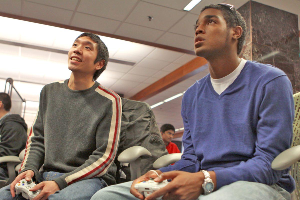 Ken Kimber, graduate student in public administration, and Eugene Yap, junior in chemistry, play Halo 3 ODST in the D.H. Hill Library. &#8220;I prefer to play in the library because of the huge screen and the people here,&#8221; Kimber said. &#8220;I come here to study but always bring my ODST for playing after.&#8221;