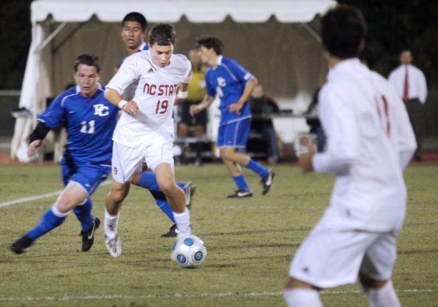 Junior midfielder Chris Zuerner dribbles down the field during Tuesday's game against Presbyterian. The men&#8217;s team won 4-2, icing the game with a goal with 47 seconds left in the match. Photo by Sarah Tudor