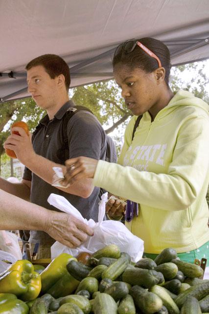 Liona Hill, a junior in business administration, came out to the Farmers Market in the Brickyard in search of fresh vegetables Sept. 2. &#8220;I heard about it last year and looked it up on their Web site. It&#8217;s a whole lot closer than on Centennial, much easier to get to,&#8221; Hill said. Photo by Jonathan Stephens