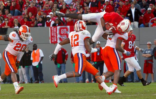 Redshirt junior Darrell Davis completes the catch while being tackled by Clemson's DeAndre McDaniel during the Pack's game against the Tigers Saturday, Nov. 14, 2009. Davis had to be helped off the field after landing awkwardly on the play. The 18-yard reception was Davis's only on the day. The team lost 23-43. Photo by Brent Kitchen