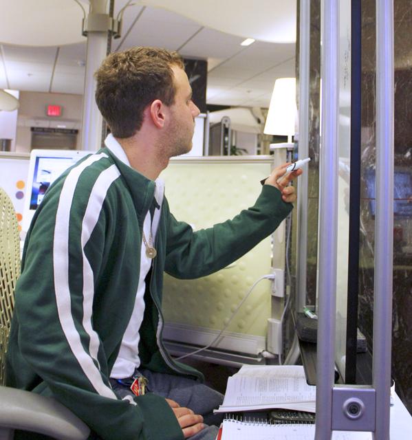 Matt Gromlich, senior in plant biology, studies for his Probability final exam Tuesday morning in the Learning Commons of D.H. Hill library. &#8220;Probability is definitely my hardest class,&#8221; Gromlich said. Photo by Kevin Cook.