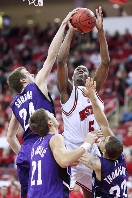 DeShawn Painter is blocked by Northwestern's John Shurna during the second half of Tuesday's game in the RBC Center. The Wolfpack was defeated by the Wildcats 65-53. Photo by Matt Moore