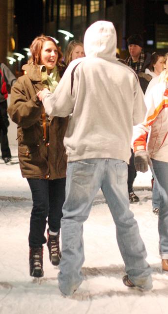Keryn Murphy, a junior in psychology, and William Turner, a junior in aerospace engineering, skate around the AT&amp;T Raleigh Winterfest Ice Rink late Wednesday night. "We came out because it was free ice skating downtown," Muphy said. "There are so many people here." Photo by Meredith Faggart