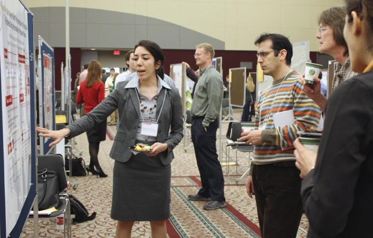 Maryam Mazloumpour, a graduate student in fiber and polymer science, talks about her research to fellow graduate students at the Graduate Student Research Symposium on Wednesday. Her research was on a plasma process that alters surfaces and as medical applications. The Symposium had 161 poster presentations representing research from 60 graduate programs from all N.C. State colleges.