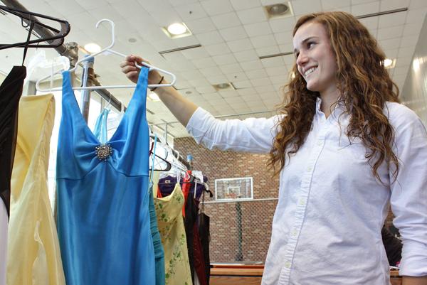 Brittany Stephens, a sophomore in psychology, sorts the dresses by size, style, cut, length and color so it is easier for the girls to find the best looking and fitting dress. &#8220;I remember being in high school and how exciting it was for me when I was going to my prom,&#8221; Stephens says. &#8220;I really wanted to make sure other girls, especially those less fortunate, have that same experience.&#8221;