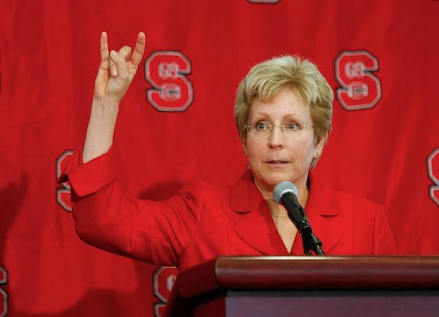 Debbie Yow tries the iconic wolf-ears at her press conference Friday, June 25, 2010. She replaces the previous athletic director Lee Fowler July 15. Photo by Tim O'Brien