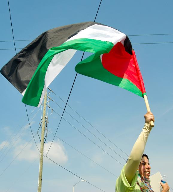 Rula Suffouri, a junior in business administration, participates in a rally against the Israeli assault of six ships, named the Freedom Flotilla, delivering aid to the Gaza Strip on June 4, 2010. "We participated in this protest in order to spread awareness to the local people about the Israeli's attack on the Turkish flotilla," said Suffouri. "There is no religion or culture that justifies these attacks against innocent people. We hope that this protest has brought awareness to this issue."