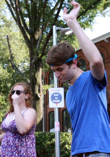 Julia Belcher, a freshman in nutrition science, and Dylan Cawthorne, a freshman in engineering, play Just Dance for Wii in the middle of Hillsborough Street. &#8220;I felt pretty ridiculous,&#8221; Cawthorne said. &#8220;But, it&#8217;s OK. It was a lot of fun.&#8221; Photo by Marisa Akers