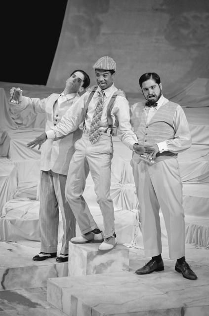 Jason Cooper, a junior in interpersonal and public relations, plays the Clown, singing with two drunker men during a musical number of University Theatre's production of Twelfth Night in Stewart Theatre during Student Preview Night on Wednesday. Photo by Kevin Cook