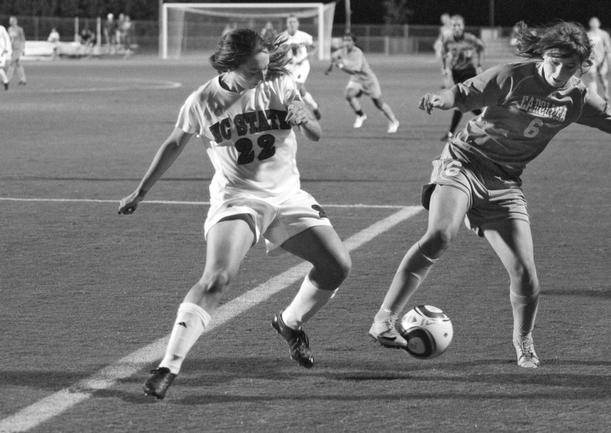 Freshman defender Randi Soldat fights a North Carolina player for the ball during N.C. State&#8217;s match against the Tar Heels at Dail Soccer Field. Despite Soldat&#8217;s efforts, the Pack ended the game scoreless, losing 0-3.