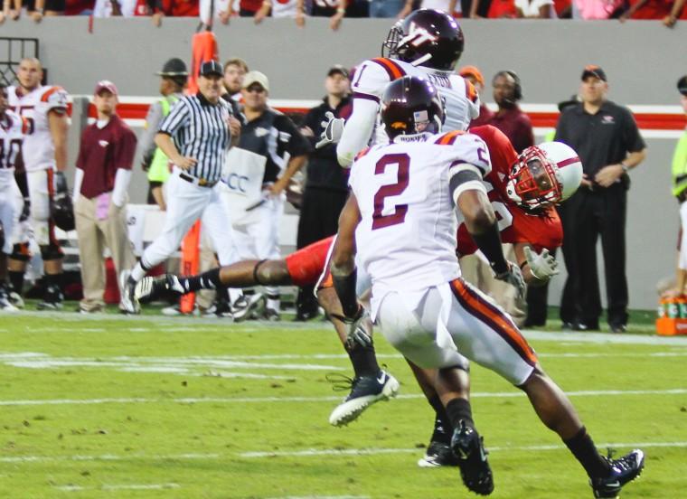 Senior wide receiver Owen Spencer catches a pass and gets tackled late in the fourth quarter of N.C. State&#8217;s 30-41 loss to Virginia Tech at Carter-Finley Stadium on Oct. 2. Spencer led the Wolfpack in receiving yards with a total of 145 on six catches. Despite Spencer&#8217;s performance, N.C. State was not able to contain the Hokies&#8217; running attack, losing its first game of the season.