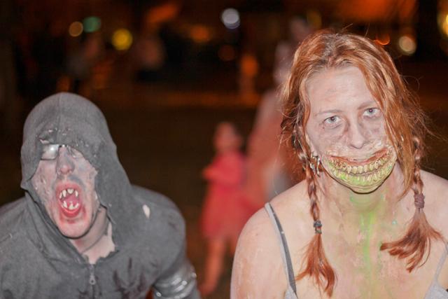Raleigh&#8217;s downtown streets filled with zombies like Ian Kreiling and Laura Danielson, an N.C. State alumna, for the 2010 Raleigh Zombie Walk Saturday. Approximately 100 participants roamed the streets scaring passers-by and crying out for brains after gathering in Moore Square Park for the annual meet. Photo by Josh Bielick.