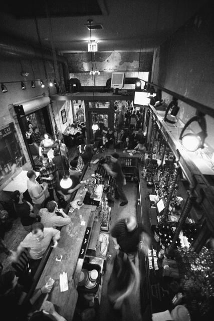 People flood into Raleigh Times Bar on Hargett Street during First Friday, Oct. 1. The building the bar is in was built in 1906 for the Raleigh Times newspaper. The newspaper stopped production in November 1989. Photo by Luis Zapata