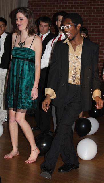 Kathryn Loyd, a freshman in chemisty, and Kenneth Howell Jr., a sophomore in international studies, are one of the first to hit the dance floor to bring back the &#8220;Roaring 20s.&#8221; &#8220;I haven&#8217;t studied much for my exams, but I wanted to come out and have fun instead of just stressing,&#8221; Loyd said. Photo by Kayu Ho