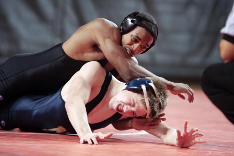 Darrius Little works to pin Joe Baker of the Naval Academy.