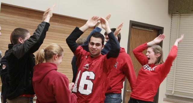 Bassil El-Zaatari, a sophomore in chemical engineering, Ben Holden, a freshman in mechanical engineering, Michelle Orlowski, a sophomore in English, and Hannah Osborne, a freshman in history, celebrate at the Quad Survival Challenge Jan. 11. "The only thing I studied for in this challenge was the name of Care Bears. Other than that, nothing came to mind," Osborne said. Photo by Danielle Neujahr
