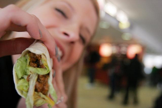 Eating a burrito at the Taco Bell Express in Talley Student Center, Madison Anderson, a freshman in First Year College, said she eats at Taco Bell despite the claims brought against their beef. "I am aware that the meat is less than half percent beef, but it is delicious, the price is hard to beat and I'm a fan of maximizing my meal plan. Photo by Alex Canoutas