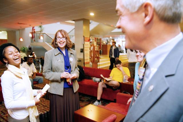 Keeping the spirits high, Adrianna Harrell, senior in english, and Evelyn Reiman, associate vice chancellor of student affairs, laugh with Tom Stafford, vice chancellor of student affairs, about life plans after his speech on stalking at Talley Student Center Thursday, Jan. 20, 2011. Reiman helped start the women's' center on campus which has been open 15 years now. Photo by Tim O'Brien