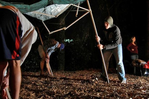 Brandon Long, senior in computer engineering, Sam Marshall and Abe Lawson, seniors in mechanical engineering, set up a tent in front of Reynolds Colosseum for the UNC ticket campout Saturday night, Jan. 15, 2011. Long was excited for the campout but "more excited about the game," he said. Photo by Tim O'Brien