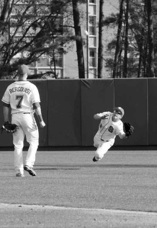 Center fielder Brett Williams, a transfer from Weatherford College in Texas, dives for an out against Elon n the Pack's season-opening series.