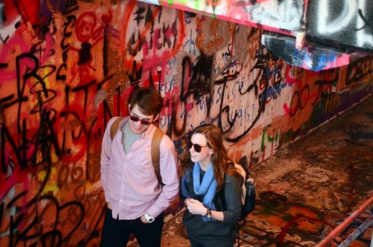 Freshman in communications and film studies Adam Cheeks and UNC sophomore in journalism and mass communication Molly Green walk through the free expression tunnel Feb. 8, 2011. Student government announced they would not create a committee to paint over offensive words and images in the tunnel, but that students could. &#8220;It&#8217;s the free expression tunnel,&#8221; Cheeks said. &#8220;I&#8217;m a Christian and there&#8217;s stuff that&#8217;s offensive to me all the time, but I&#8217;m not writing over it.&#8221; Photo by Alex Sanchez.