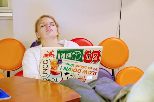 Sleeping quietly in the Learning Commons, Ashley Junkins, a senior in international studies, takes a break from writing a paper at 5 a.m. on Wednesday. Jenkins said she frequents the library at all hours and has made acquaintances with the staff. "I've basically sold my soul to the library."
